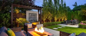 clean sculpted backyard with fire pit.