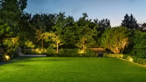 Perfect grass lawn plateau, lit with exterior lights.